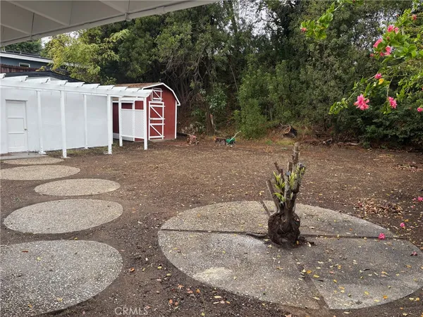 a backyard of a house with seating space