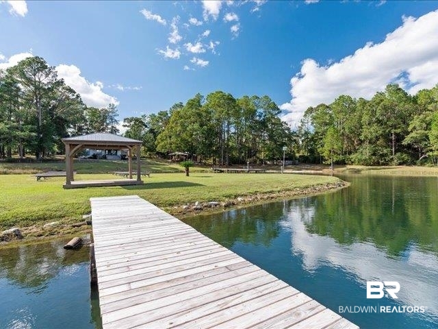 4650 Wiggins Lane Wilmer, AL 36587 - Photo 36 of 66 Dock area with a water view, a yard, and a gazebo