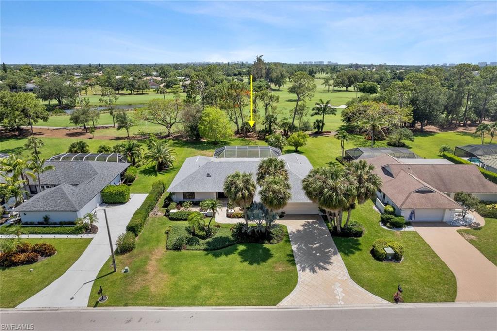 an aerial view of a house with a garden