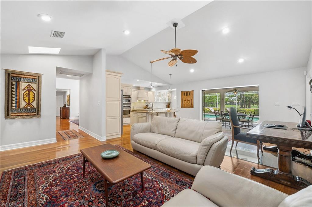 1986 Imperial Golf Course Boulevard Naples, FL 34110 - Photo 14 of 38 a living room with furniture kitchen view and a large window