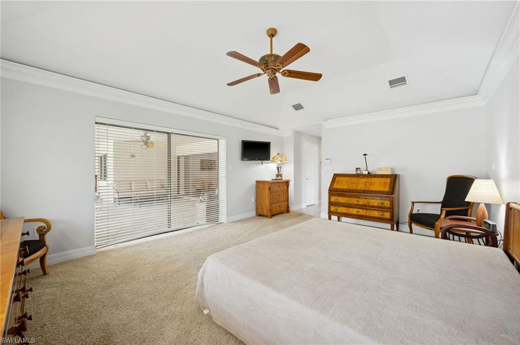 1986 Imperial Golf Course Boulevard Naples, FL 34110 - Photo 17 of 38 a bedroom with furniture and a large window