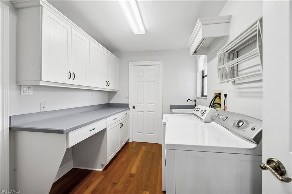 1986 Imperial Golf Course Boulevard Naples, FL 34110 - Photo 22 of 38 a utility room with sink dryer and washer