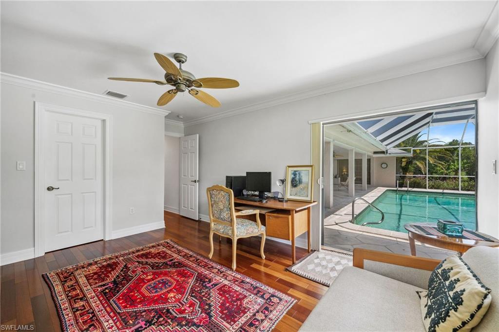 1986 Imperial Golf Course Boulevard Naples, FL 34110 - Photo 26 of 38 a work room with furniture and a large window
