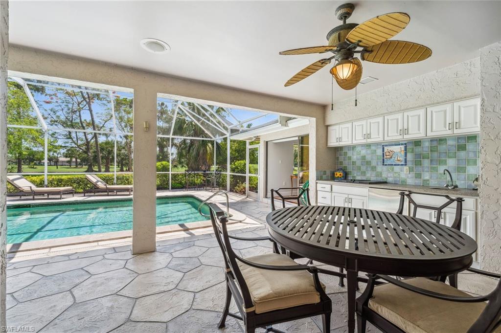1986 Imperial Golf Course Boulevard Naples, FL 34110 - Photo 28 of 38 a view of a dining room with furniture window and outside view