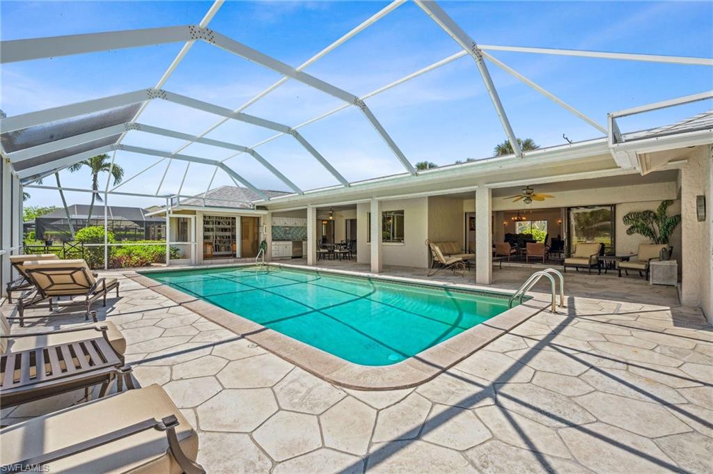 1986 Imperial Golf Course Boulevard Naples, FL 34110 - Photo 32 of 38 a house with garden in front of it