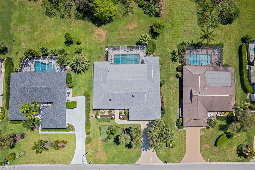 1986 Imperial Golf Course Boulevard Naples, FL 34110 - Photo 35 of 38 an aerial view of a house with a yard