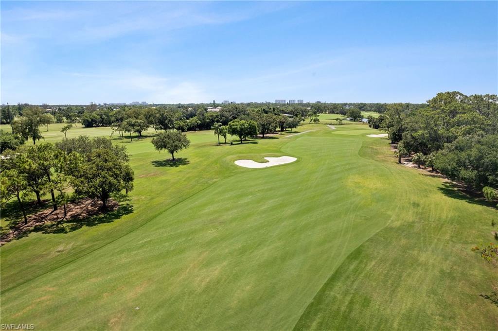 1986 Imperial Golf Course Boulevard Naples, FL 34110 - Photo 36 of 38 a view of a lake with a houses