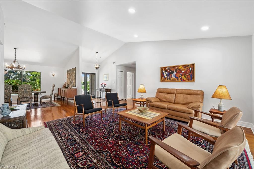 1986 Imperial Golf Course Boulevard Naples, FL 34110 - Photo 6 of 38 a living room with furniture a rug and a lamp