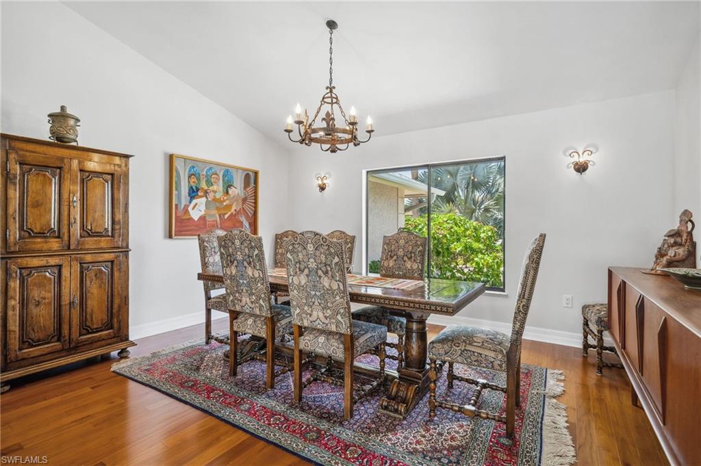 1986 Imperial Golf Course Boulevard Naples, FL 34110 - Photo 7 of 38 a view of a dining room with furniture window and wooden floor