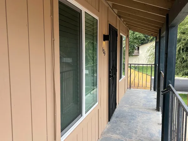 a view of a glass door and the balcony