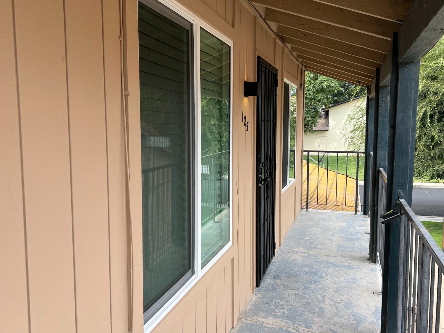 a view of a glass door and the balcony