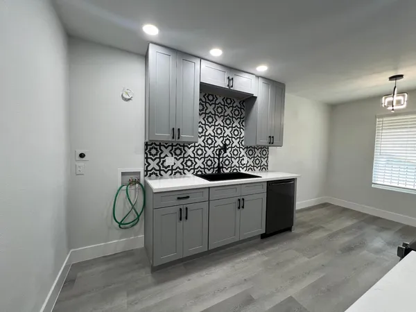 a bathroom with double vanity and a shower