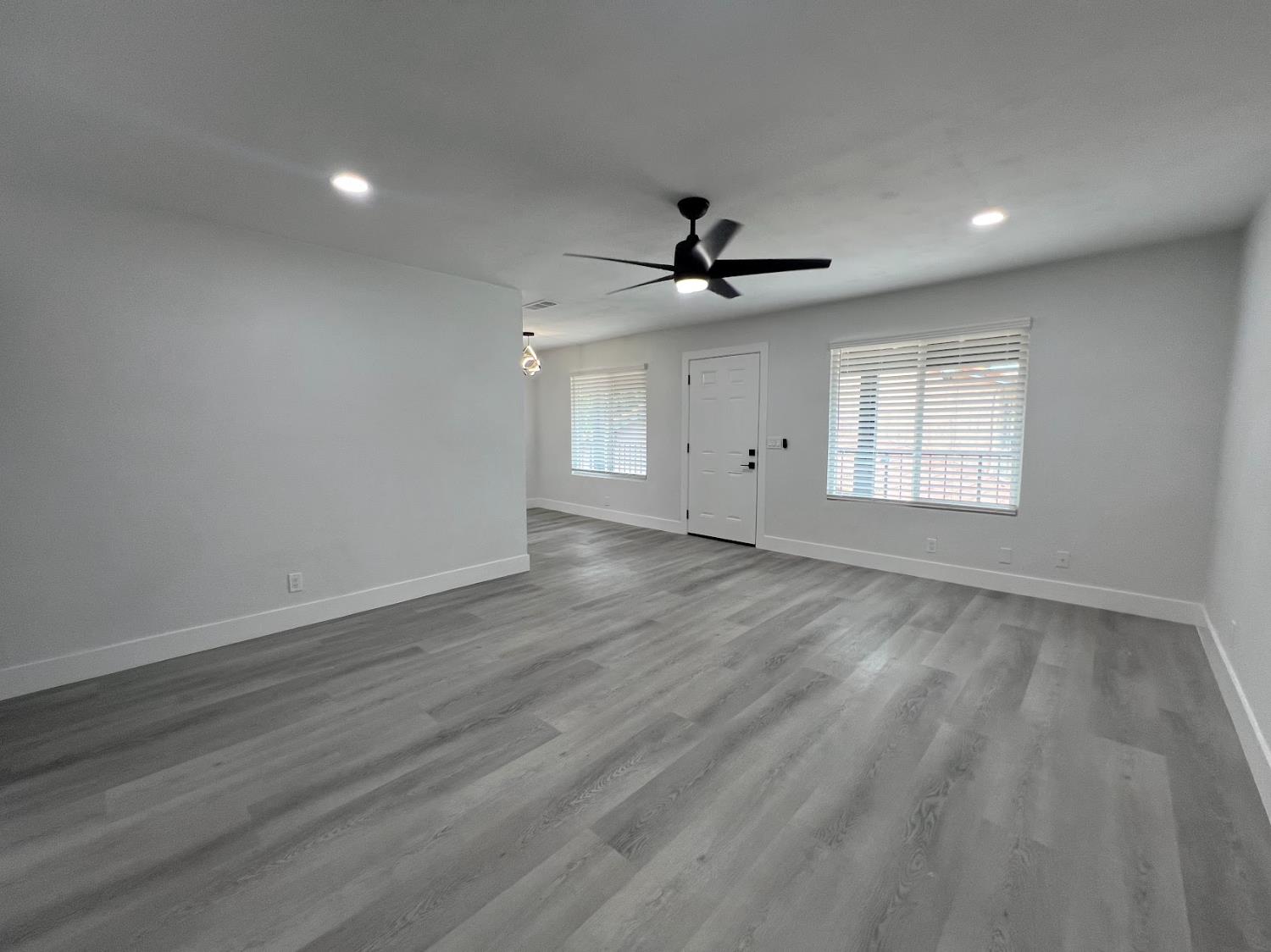 657 West Parlier Avenue, Unit 125 Reedley, CA 93654 - Photo 5 of 25 a view of an empty room with a window and a kitchen