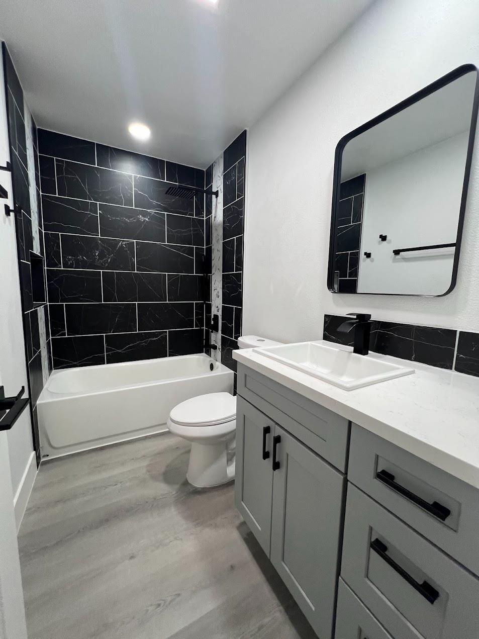 657 West Parlier Avenue, Unit 125 Reedley, CA 93654 - Photo 7 of 25 a bathroom with a sink a toilet and shower
