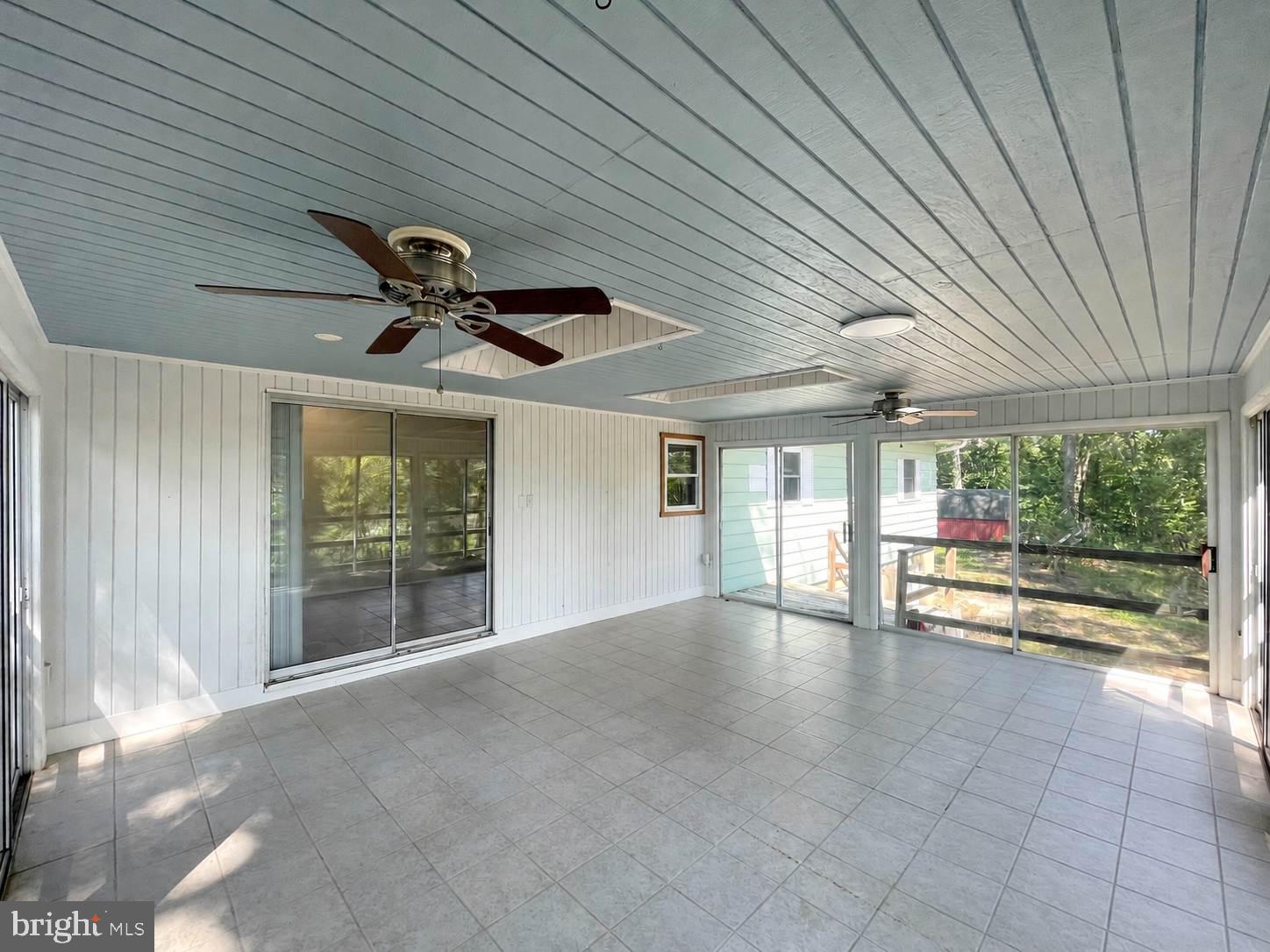5472 Sixes Road Prince Frederick, MD 20678 - Photo 14 of 37 Large rear screened porch with waterviews