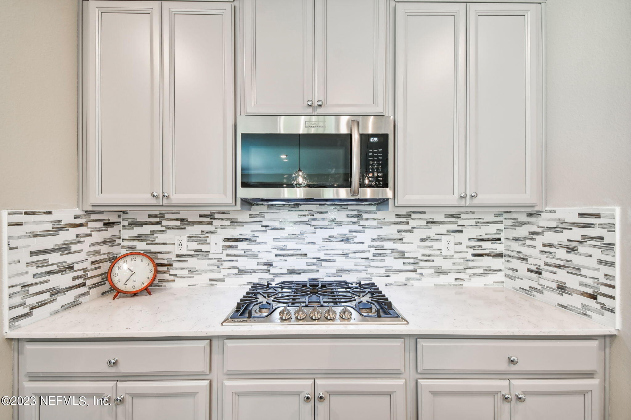 32 Quota Circle St. Johns, FL 32259 - Photo 14 of 79 a kitchen with granite countertop white cabinets and white appliances