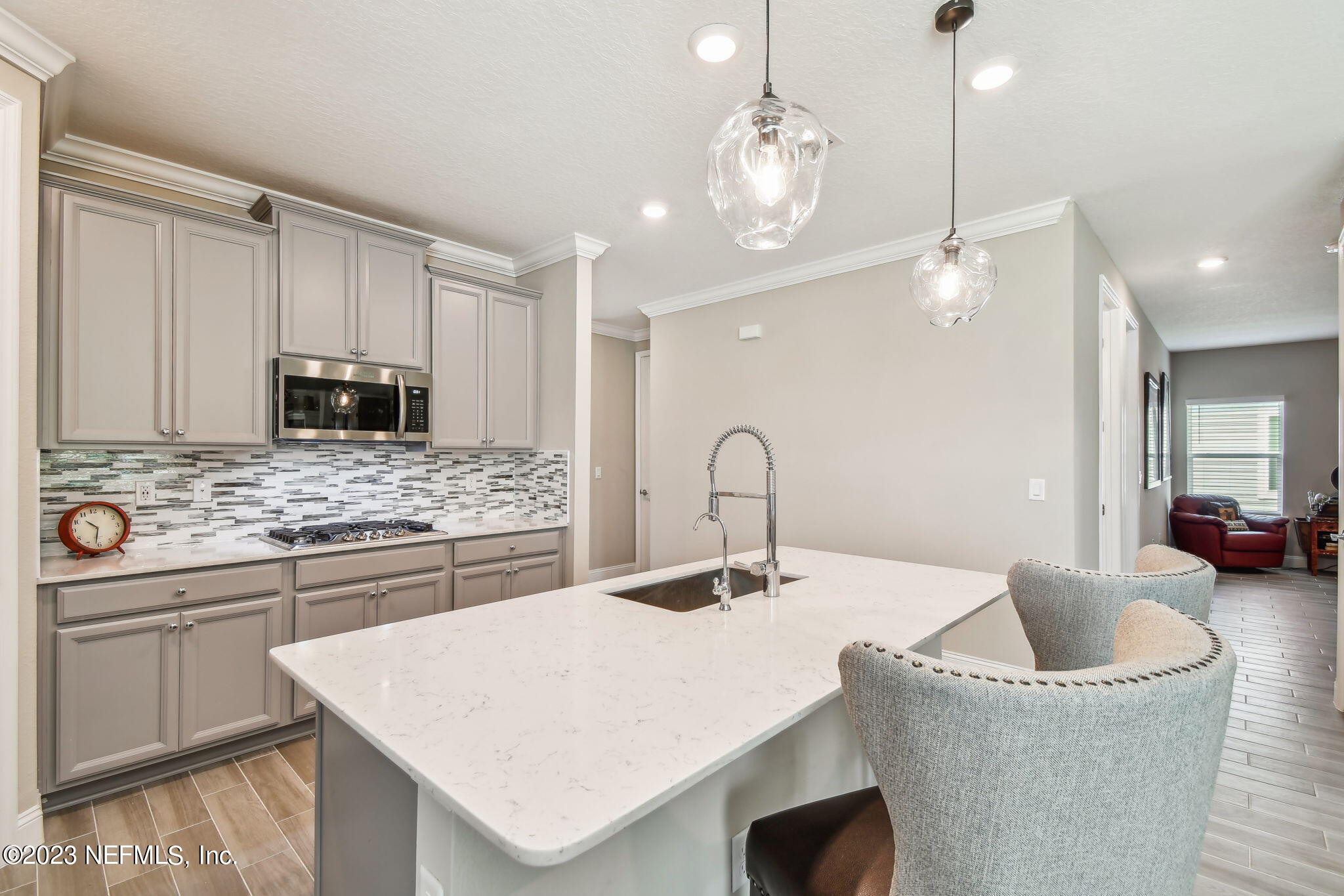 32 Quota Circle St. Johns, FL 32259 - Photo 16 of 79 a kitchen with a sink a stove and chairs