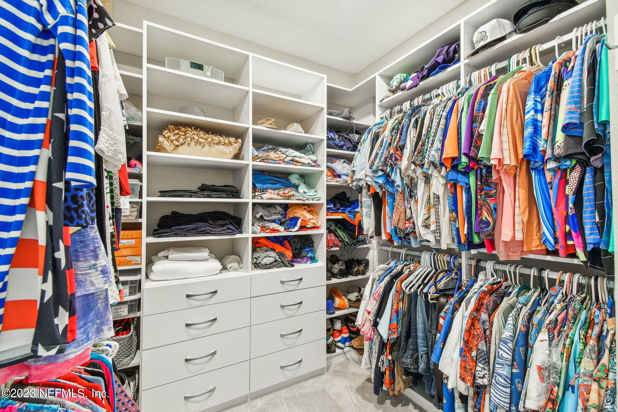 32 Quota Circle St. Johns, FL 32259 - Photo 43 of 79 a view of walk in closet with clothes and shoes