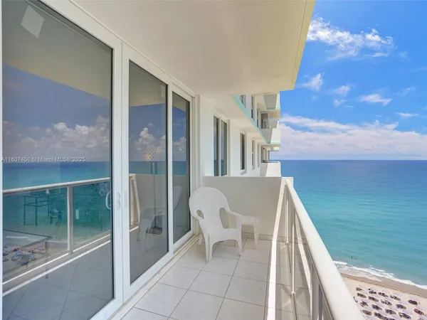 a view of balcony with furniture