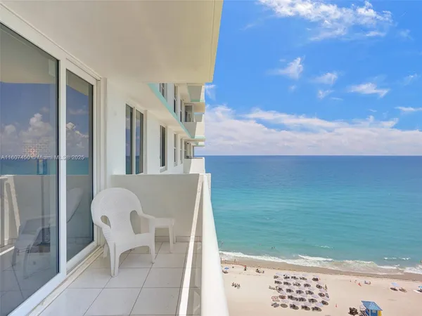 a view of balcony with furniture
