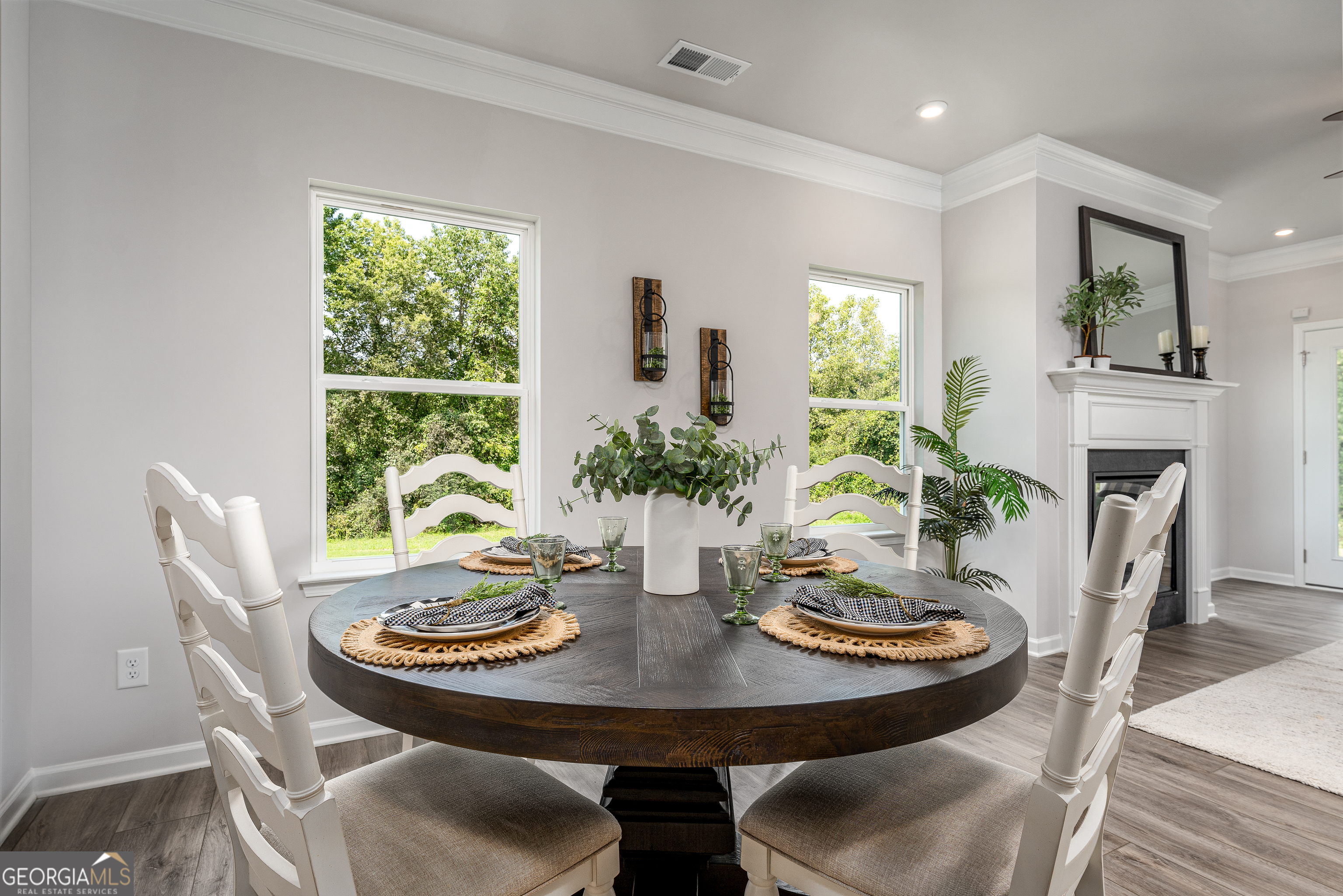1393 Trellis Court Hampton, GA 30228 - Photo 14 of 25 a view of a dining room with furniture window and wooden floor