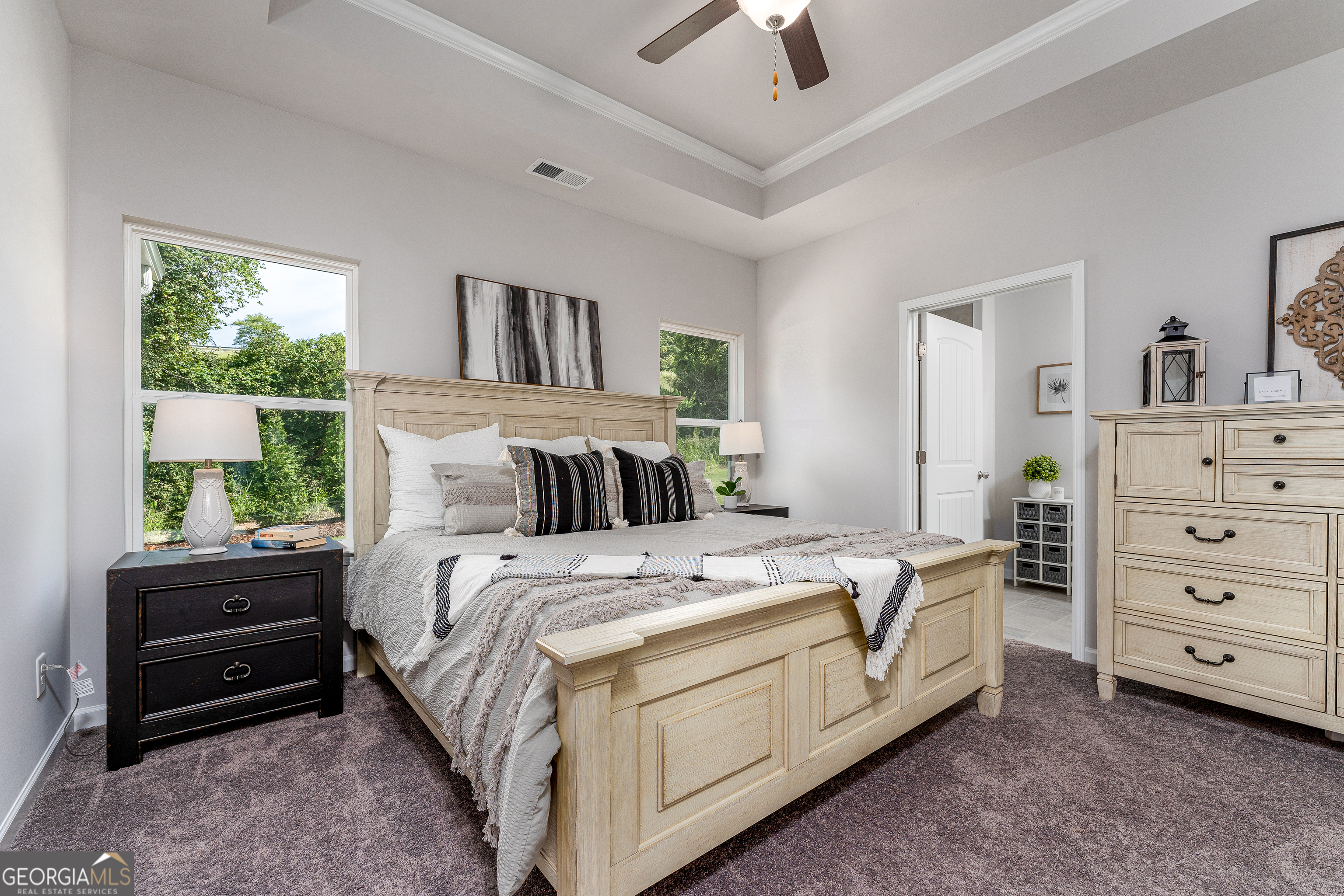 1393 Trellis Court Hampton, GA 30228 - Photo 18 of 25 a bed room with a bed and a dresser