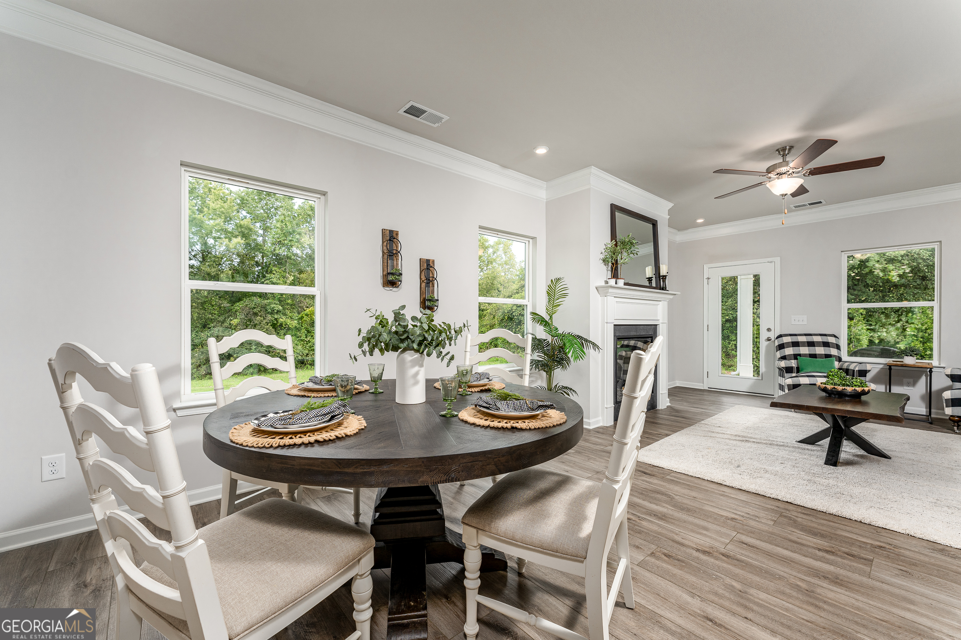 1393 Trellis Court Hampton, GA 30228 - Photo 2 of 25 a view of a dining room with furniture window and wooden floor