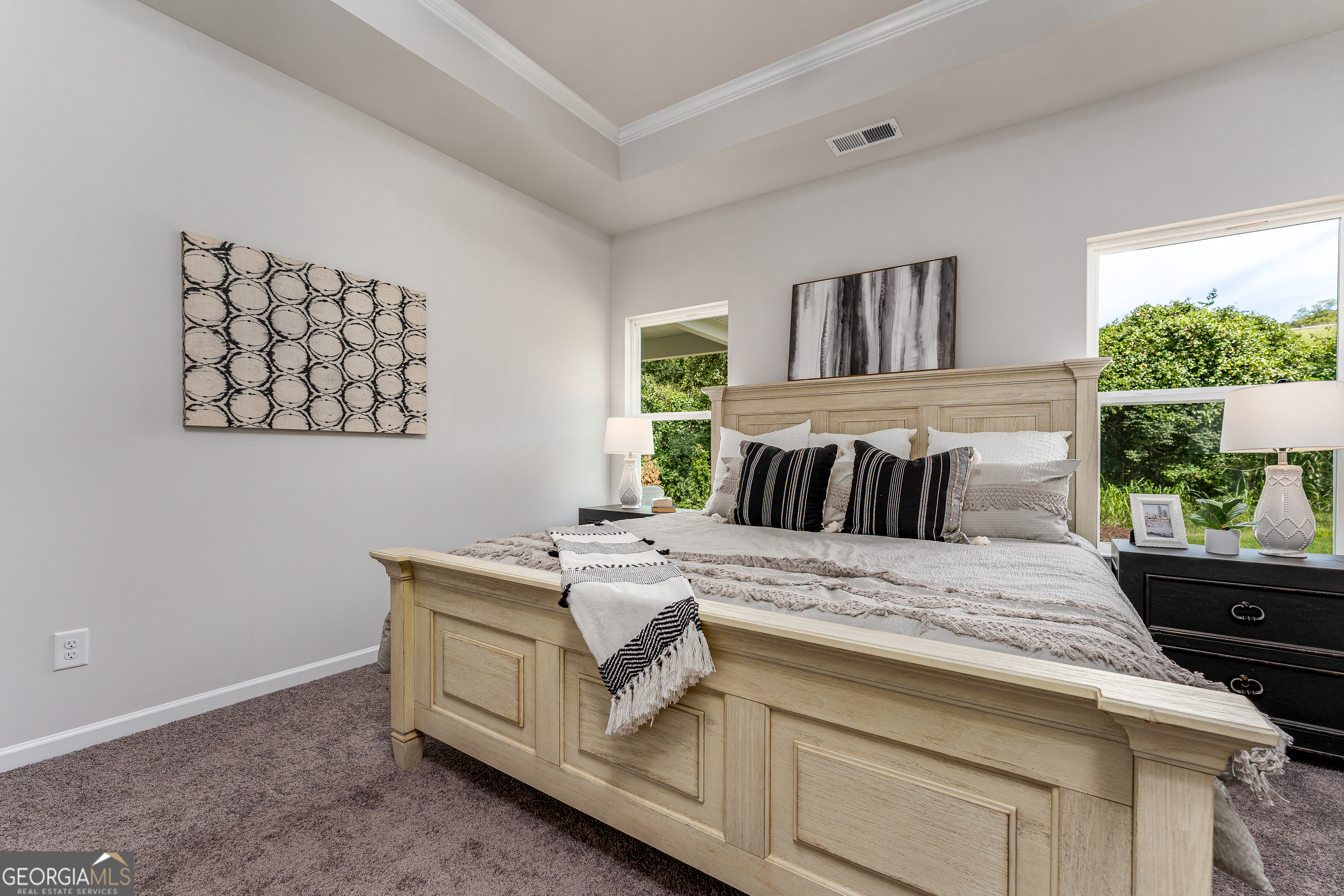 1393 Trellis Court Hampton, GA 30228 - Photo 21 of 25 a bed sitting in a bedroom next to a window