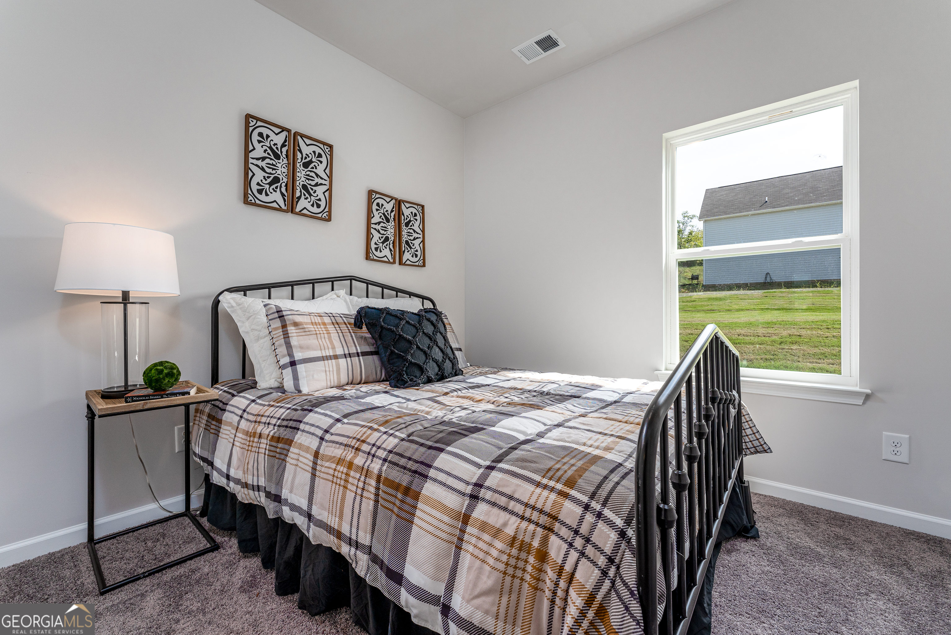 1393 Trellis Court Hampton, GA 30228 - Photo 23 of 25 a bedroom with a bed and a window