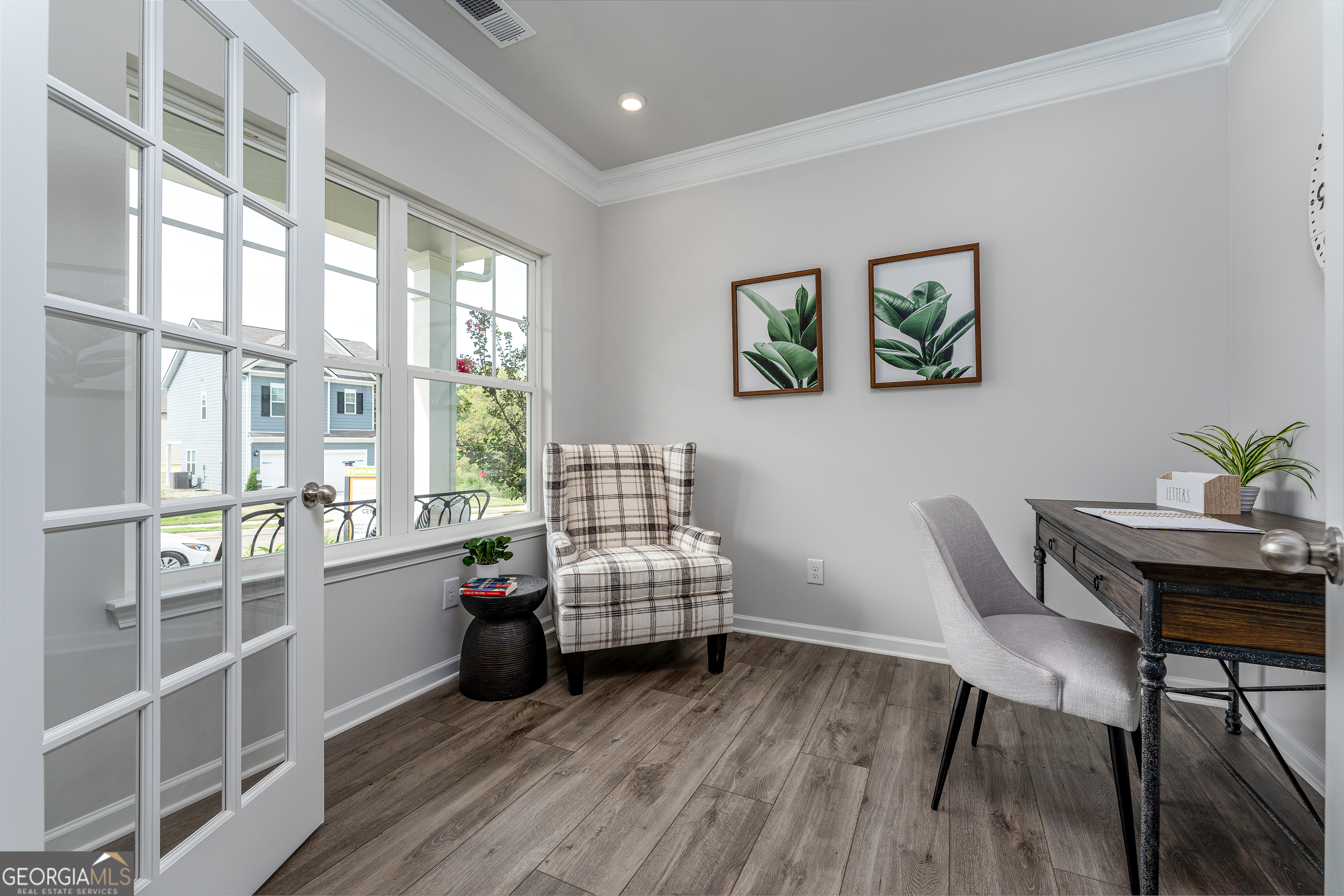 1393 Trellis Court Hampton, GA 30228 - Photo 5 of 25 a living room with furniture and wooden floor