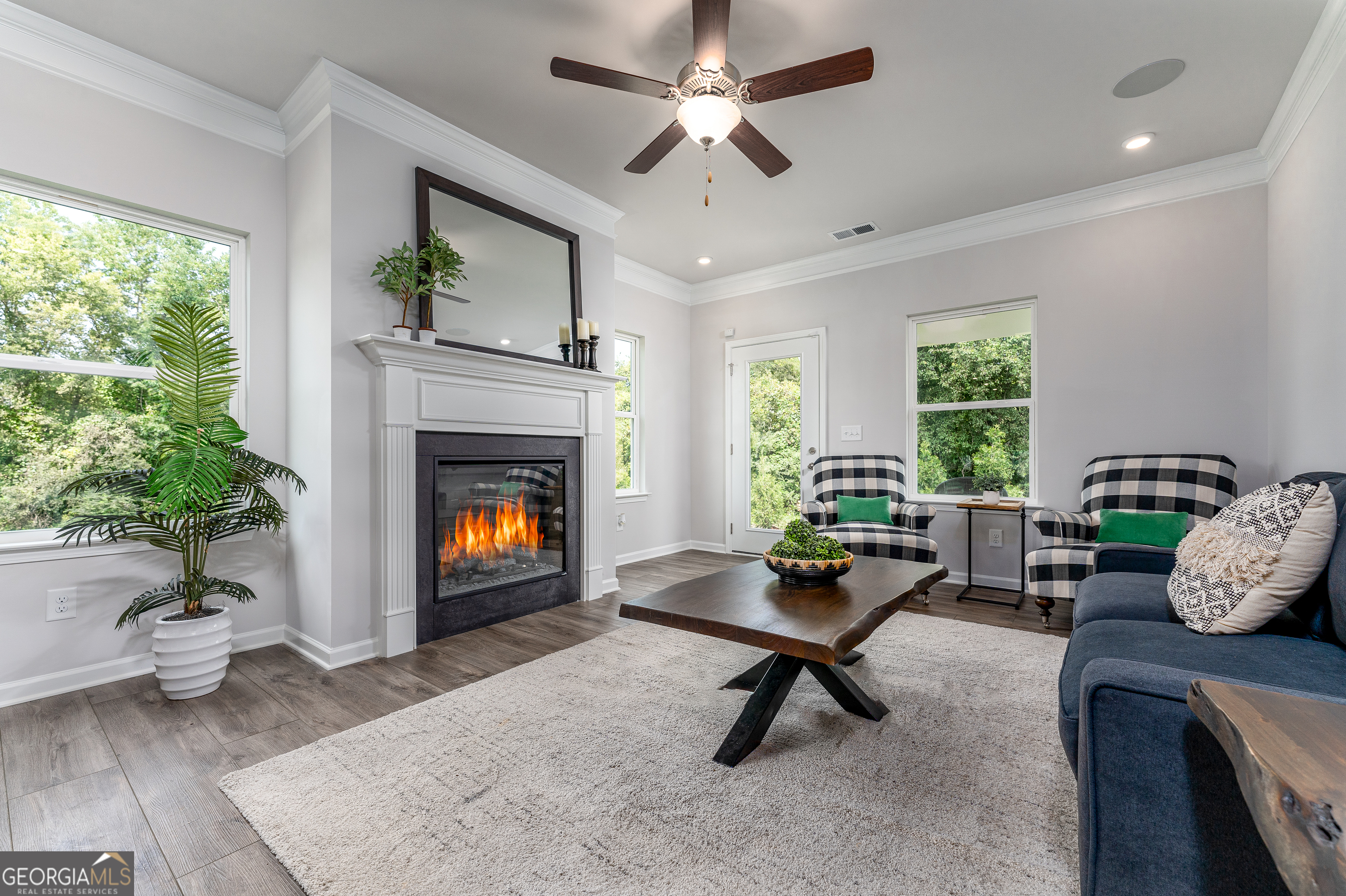 1393 Trellis Court Hampton, GA 30228 - Photo 10 of 25 a living room with furniture and a fireplace