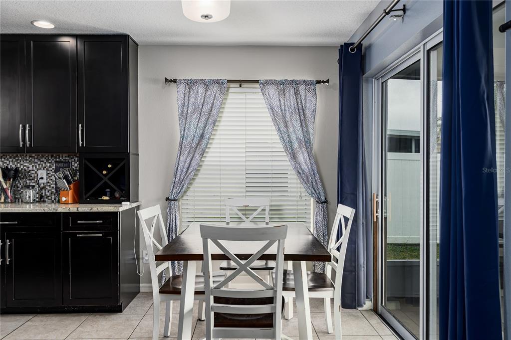 11493 Walden Loop Parrish, FL 34219 - Photo 11 of 30 a dining room with furniture and window
