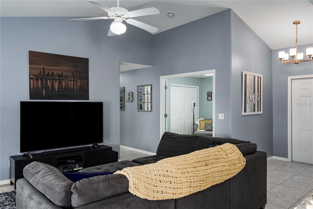 11493 Walden Loop Parrish, FL 34219 - Photo 14 of 30 a living room with furniture and a flat screen tv