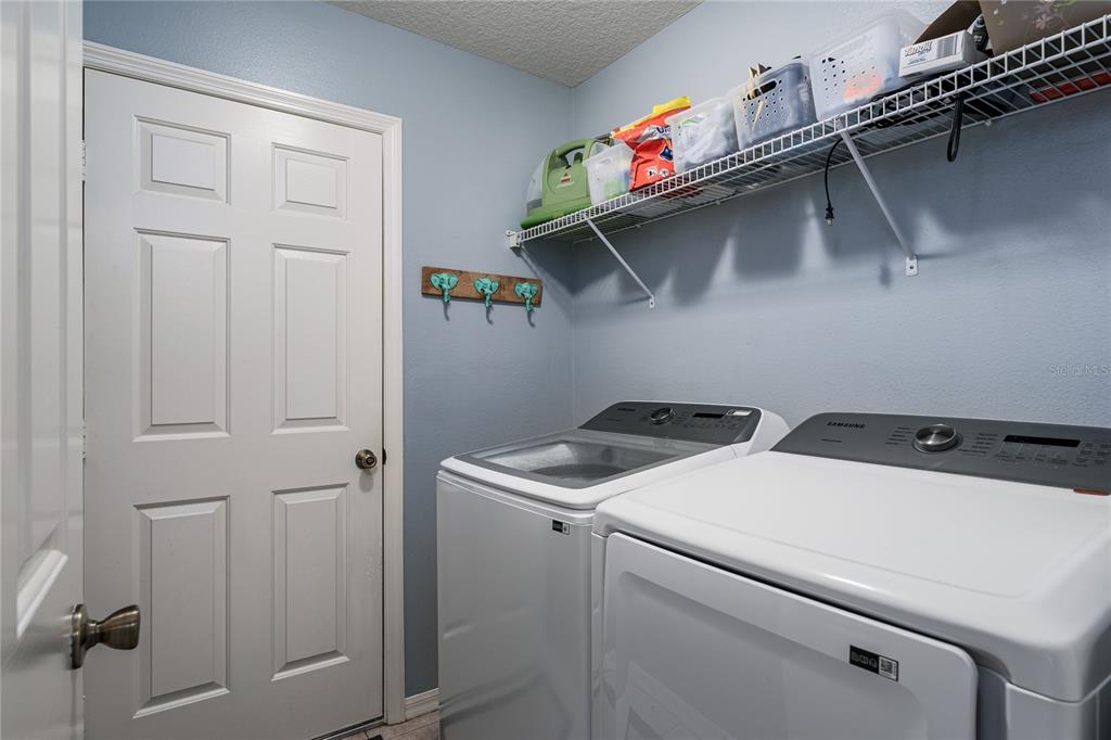 11493 Walden Loop Parrish, FL 34219 - Photo 19 of 30 a utility room with dryer and washer