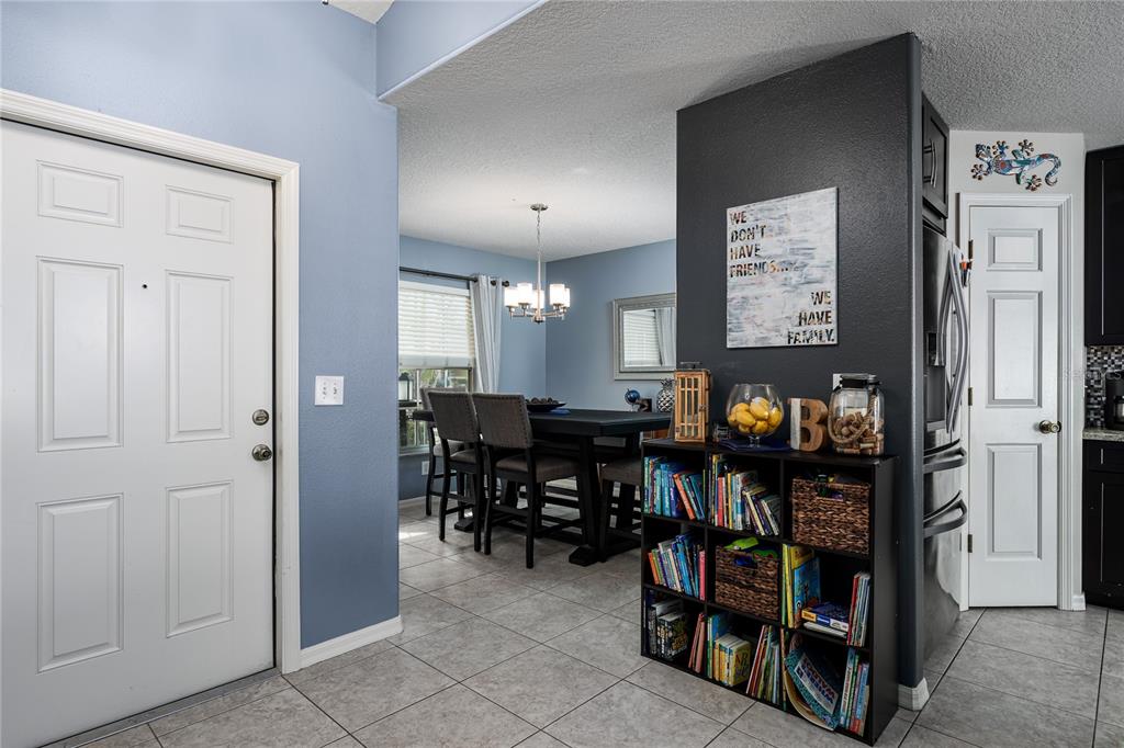 11493 Walden Loop Parrish, FL 34219 - Photo 6 of 30 a view of a dining room with furniture