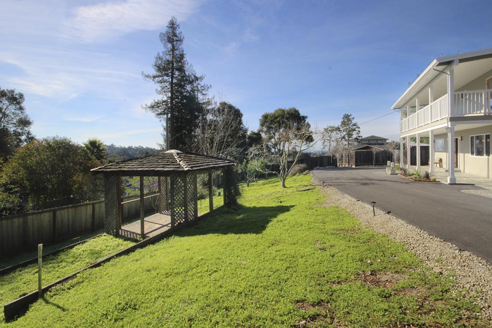 125 Charman Hill Road Aptos, CA 95003 - Photo 4 of 22 a view of a house with backyard and sitting area