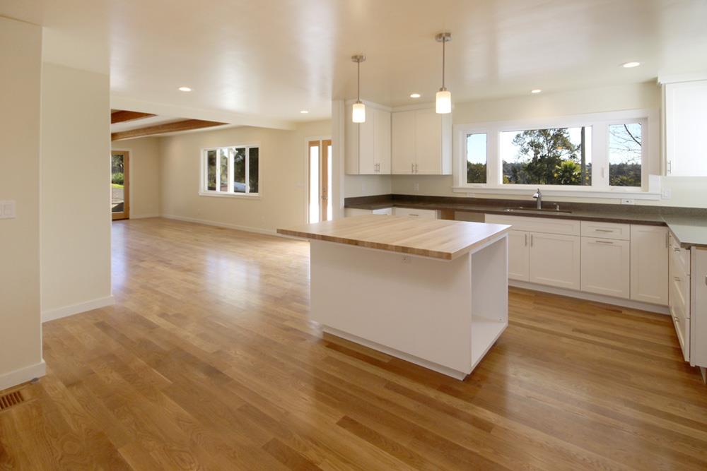 125 Charman Hill Road Aptos, CA 95003 - Photo 6 of 22 a large kitchen with granite countertop a white stove top oven and cabinets