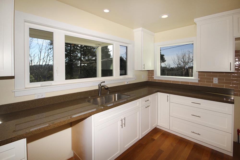 125 Charman Hill Road Aptos, CA 95003 - Photo 8 of 22 a view of a kitchen sink and dishwasher with wooden floor