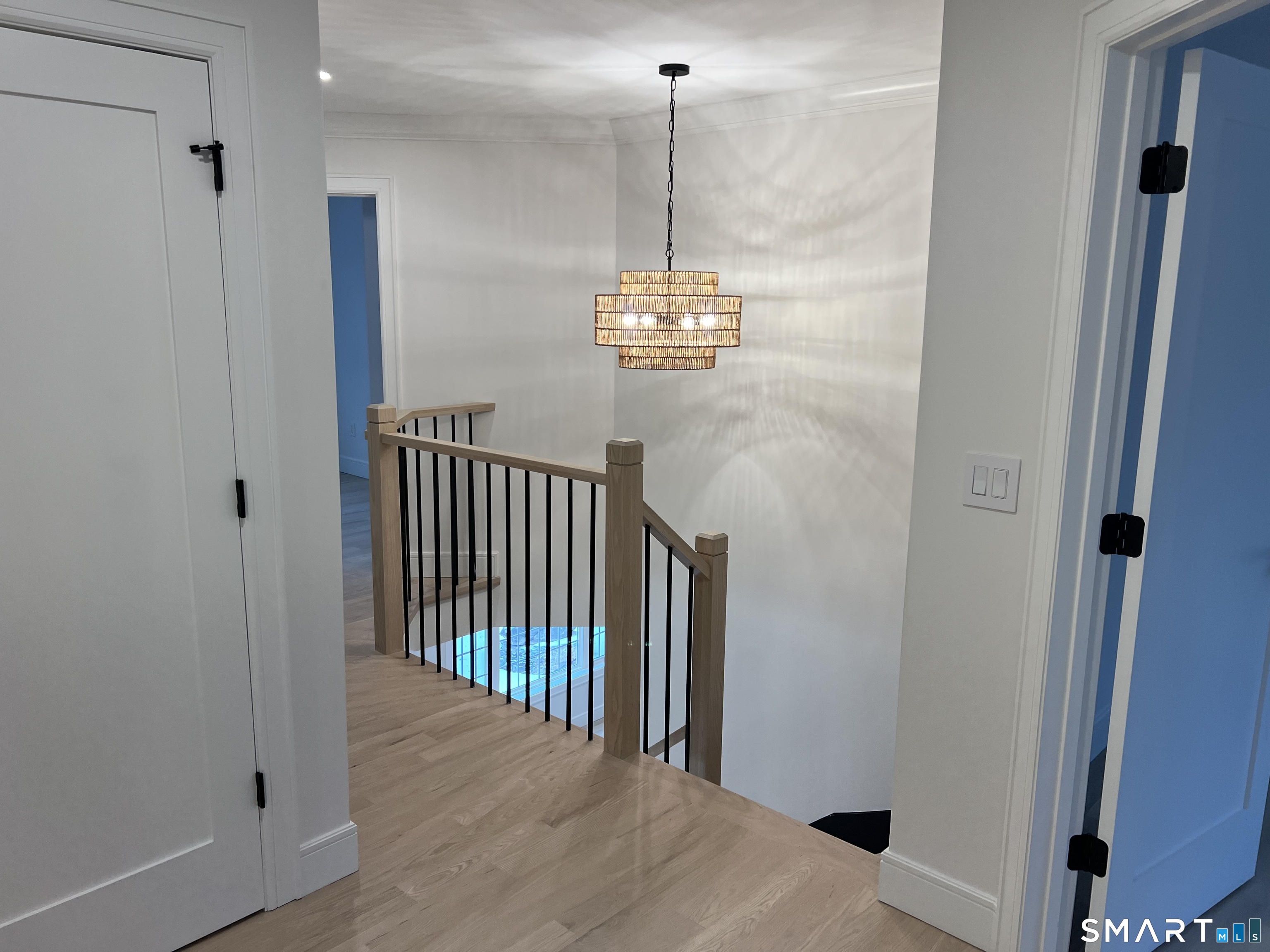 39 Lafayette Road Marlborough, CT 06447 - Photo 39 of 39 a view of a hallway with windows and chandelier