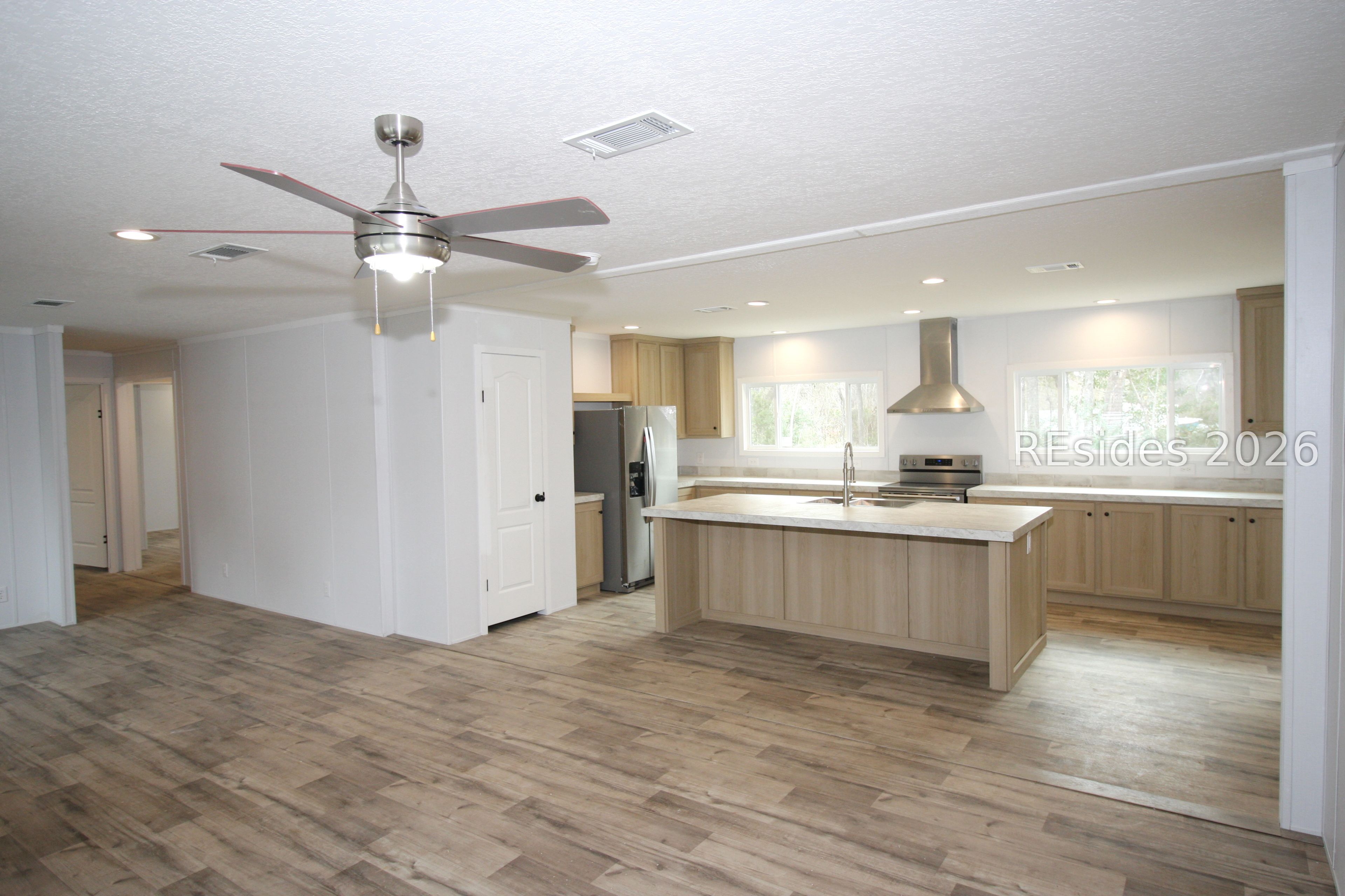24 Unity Lane Seabrook, SC 29940 - Photo 3 of 20 Living to kitchen