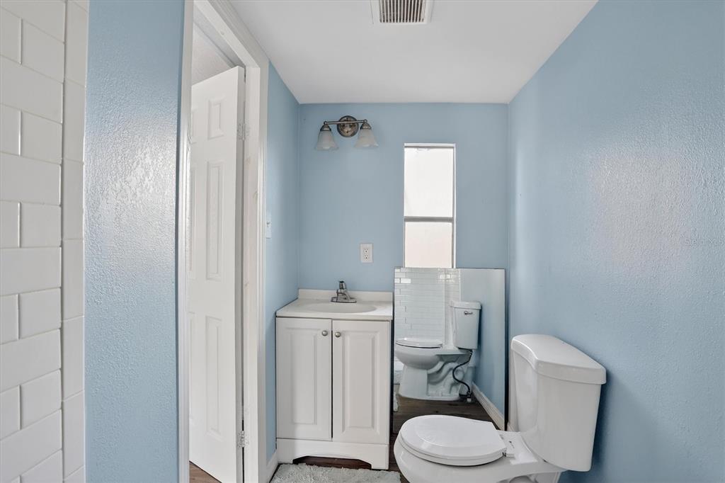 18441 Rigsby Road Spring Hill, FL 34610 - Photo 12 of 23 a white toilet sitting next to a bathroom sink