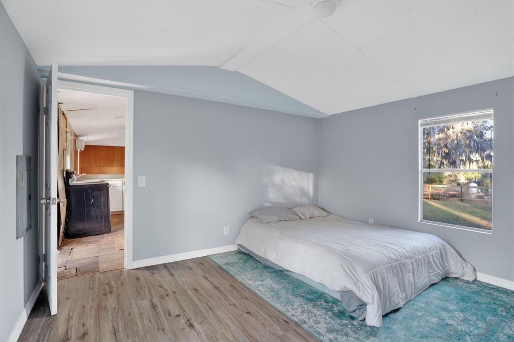 18441 Rigsby Road Spring Hill, FL 34610 - Photo 14 of 23 a bedroom with a bed and a window