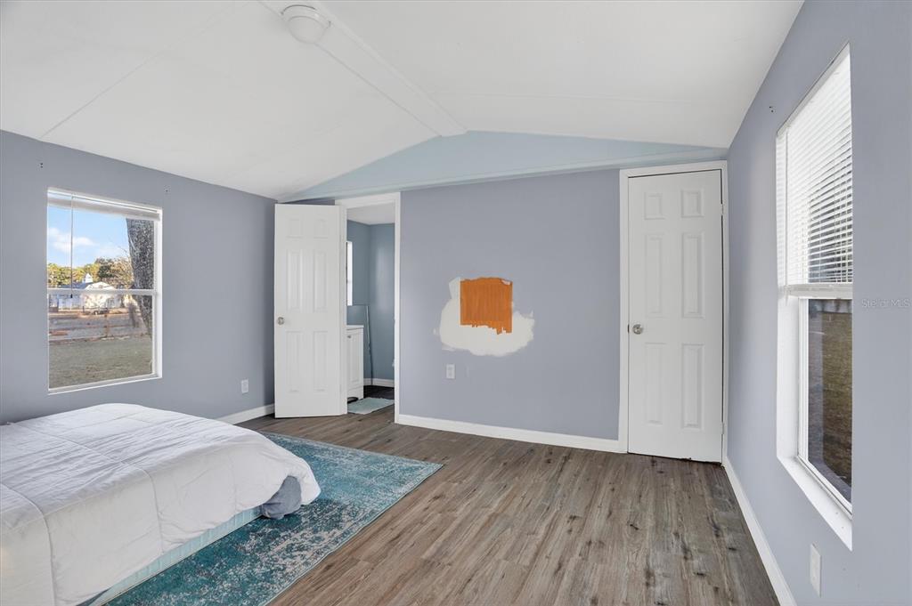 18441 Rigsby Road Spring Hill, FL 34610 - Photo 15 of 23 a bedroom with a bed and a window