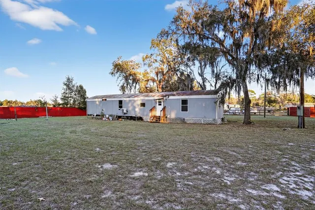a view of a house with a tree