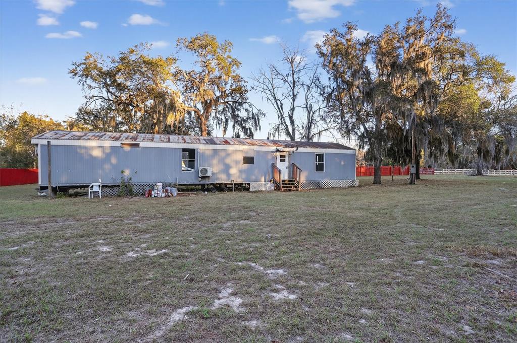 18441 Rigsby Road Spring Hill, FL 34610 - Photo 20 of 23 a view of a house with a tree