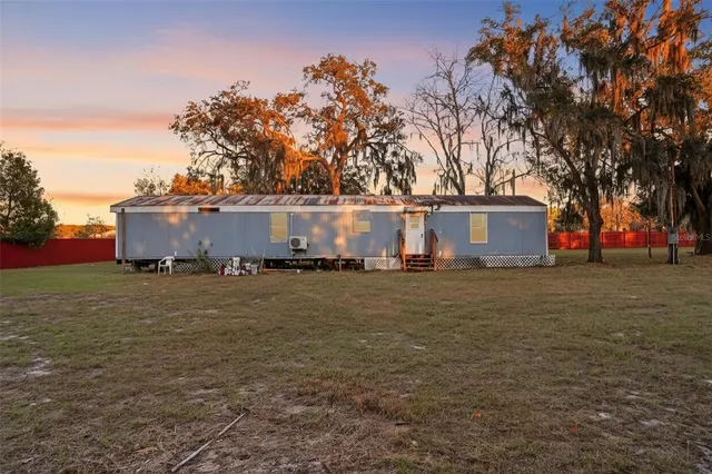 a view of road with large trees