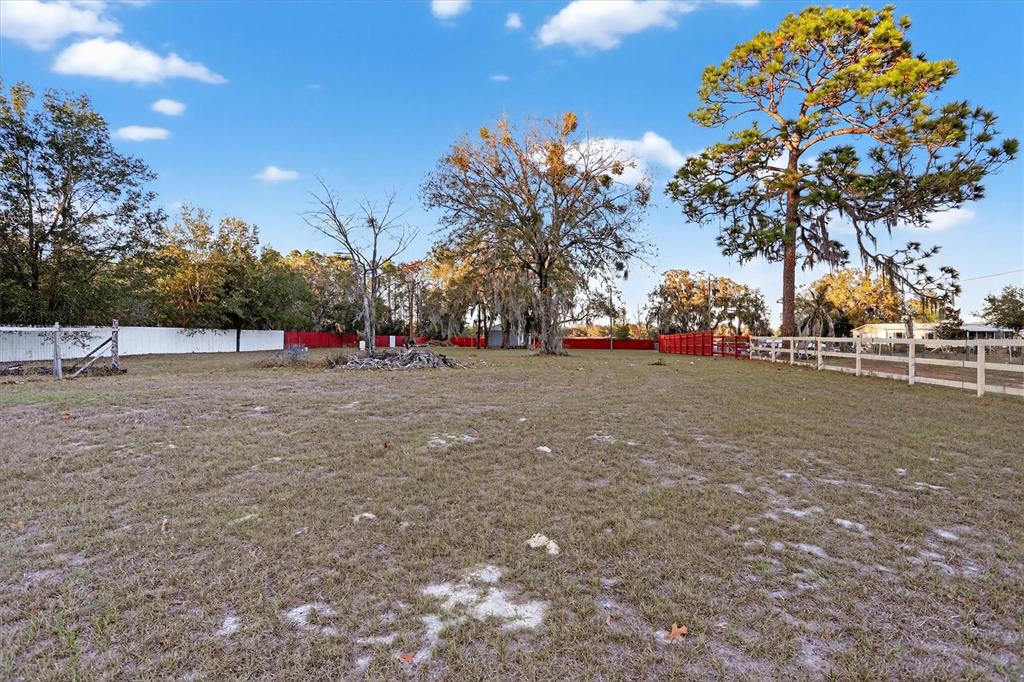 18441 Rigsby Road Spring Hill, FL 34610 - Photo 22 of 23 a view of outdoor space with playground and green space
