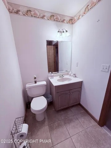 a bedroom with two beds and a chandelier