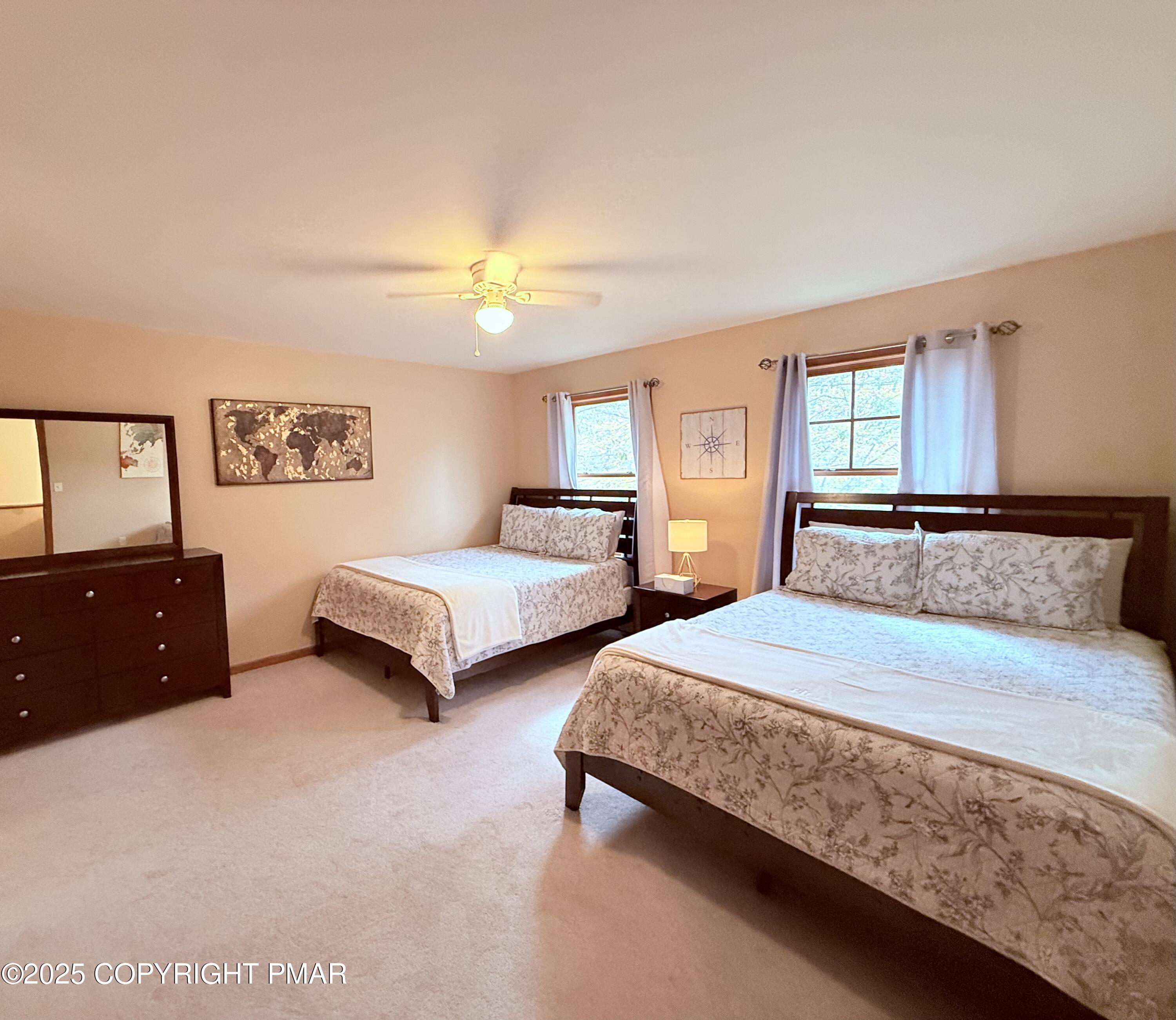 238 Dorset Road Tobyhanna, PA 18466 - Photo 15 of 24 a bedroom with two beds and a chandelier