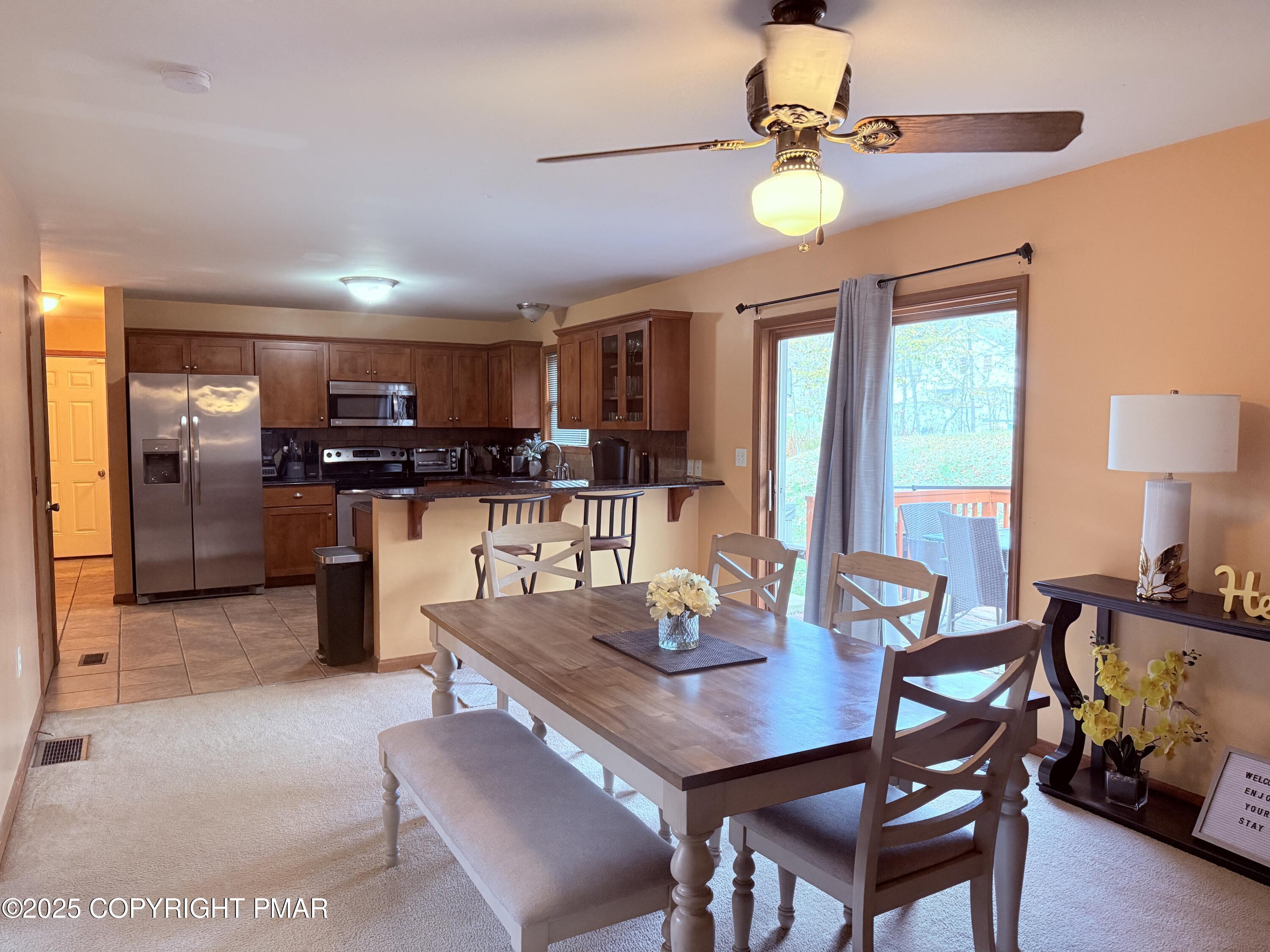 238 Dorset Road Tobyhanna, PA 18466 - Photo 2 of 24 a view of a dining room with furniture and a chandelier